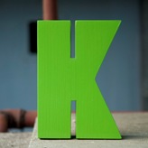 Litera K verde